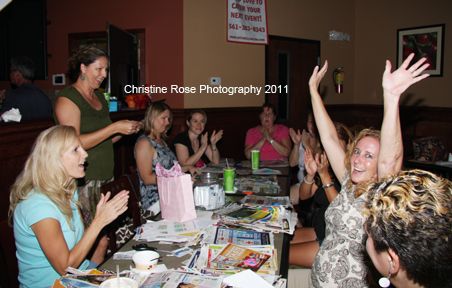 One happy raffle winner at our September AroundWellington.com Coupon Swap, which was held at the Nature's Table Cafe. Photo by Christine Rose.